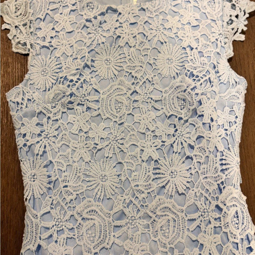 Embellished Sleeveless light blue dress, knee length.